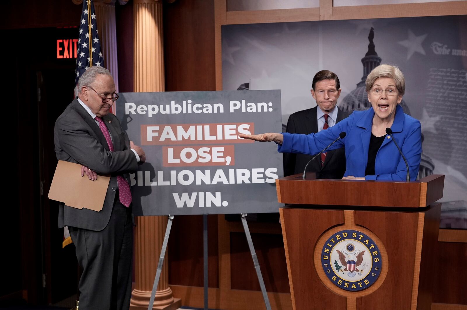 Senate Minority Leader Chuck Schumer, D-N.Y., from left, and Sen. Richard Blumenthal, D-Conn., listen as Sen. Elizabeth Warren, D-Mass., speaks about the Republican-backed budget plan during a news conference at the Capitol, in Washington, Thursday, April 3, 2025. (AP Photo/J. Scott Applewhite)