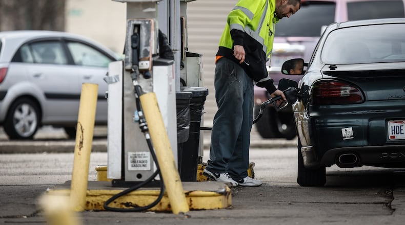 William Bussell, of Dayton, fills-up his vehicle for $3.85 a gallon at Big Daddy's Mini Mart & Gas on East Third Street in Dayton Thursday, March 24, 2022. Gas prices are dropping for now, but experts warn that motorists shouldn't get too used to it. JIM NOELKER/STAFF