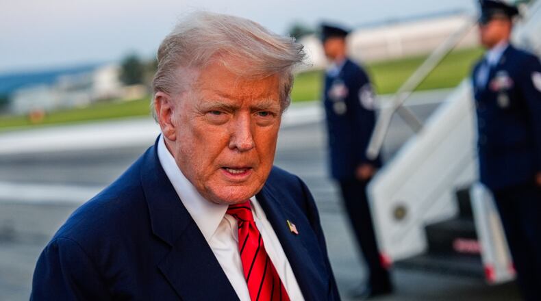 President Donald Trump speaks with reporters before boarding Air Force One at Lehigh Valley International Airport, Sunday, Aug. 3, 2025, in Allentown, Pa. (AP Photo/Julia Demaree Nikhinson)
