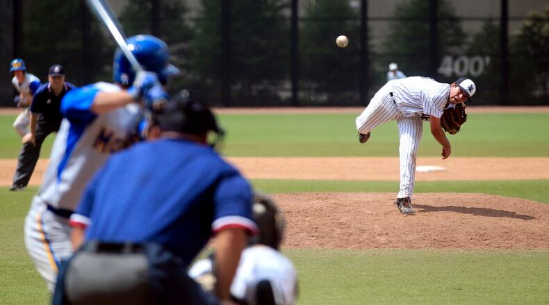 Lakota East’s Andy Almquist fires a pitch during a Division I regional semifinal against Moeller at the University of Cincinnati’s Marge Schott Stadium on May 30, 2013. JOURNAL-NEWS FILE PHOTO