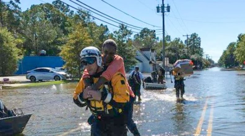 Retired Lt. Ray Smith and Lt. David Oakley spent time with Ohio Task Force 1 helping combat the effects of Hurricane Matthew in North Carolina. GREG LYNCH / STAFF