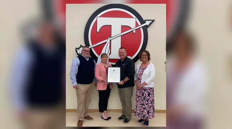 Tecumseh High School AFJROTC instructor Major Doug Couch was recognized on Tuesday, April 30, and given a proclamation from the Clark County Commissioner's Office for his heroic effort to successfully perform the Heimlich maneuver on a student. In the photo (from left to right) is high school principal Aaron Oakes, county commissioner Sasha Rittenhouse, Couch and superintendent Paula Crew. Contributed