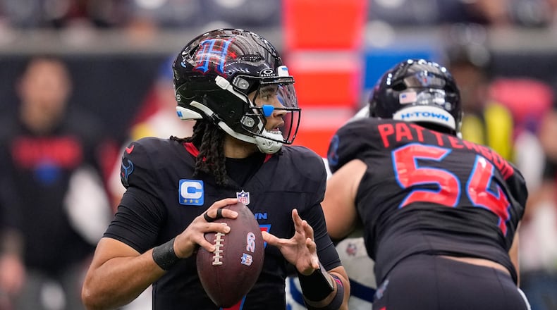 Houston Texans quarterback C.J. Stroud (7) looks to pass against the Indianapolis Colts during the first half of an NFL football game in Houston, Sunday, Jan. 4, 2026. (AP Photo/David J. Phillip)