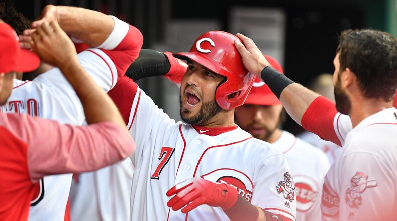 CINCINNATI, OH - JUNE 22: Eugenio Suarez #7 of the Cincinnati Reds celebrates in the dugout after hitting a two-run home run in the fifth inning against the Chicago Cubs at Great American Ball Park on June 22, 2018 in Cincinnati, Ohio. Cincinnati defeated Chicago 6-3. (Photo by Jamie Sabau/Getty Images)