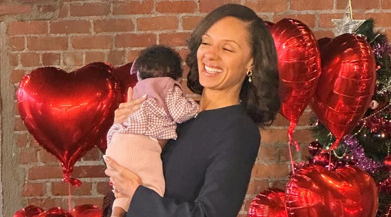 Detroit Mayor Mary Sheffield holds child during an announcement of the city's participation in Rx Kids program that provides cash to help expectant mothers, Monday, Jan. 5, 2025, in Detroit. (AP Photo/Corey Williams)