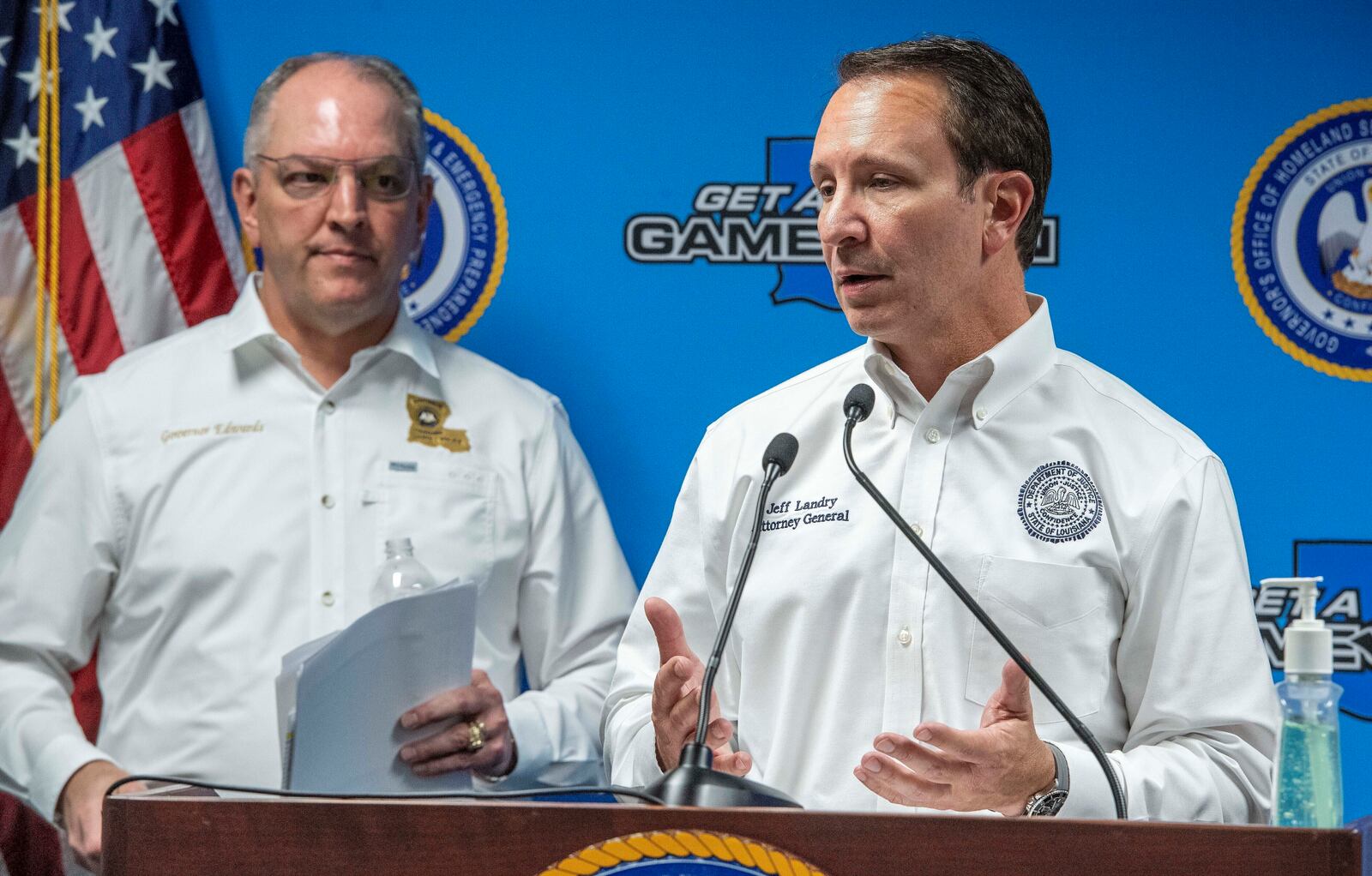 FILE - Louisiana Gov. John Bel Edwards, left, listens as Attorney General Jeff Landry, right, speaks during a news conference at the Governor's Office of Homeland Security & Emergency Management, April 6, 2020, in Baton Rouge, La. (Bill Feig/The Advocate via AP, Pool, File)