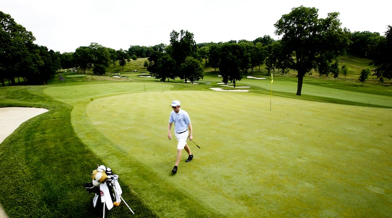Former Ohio Amateur champ, Michael Bernard walks off of 15 during the first round of Ohio Amateur Tuesday July 12, 2011, at the NCR Country Club. STAFF PHOTO JIM NOELKER