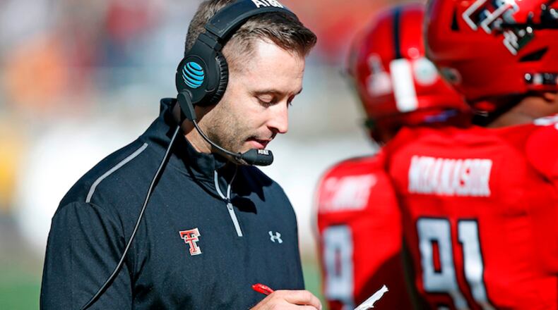 Texas Tech coach Kliff Kingsbury looks down at his notes during the second half of the NCAA college football game TCU, Saturday, Nov. 18, 2017, in Lubbock, Texas. (AP Photo/Brad Tollefson)