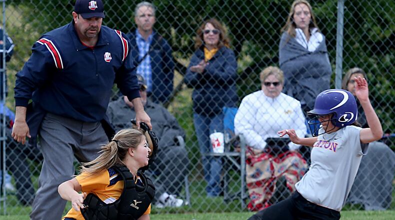 Monroe catcher Sarah Eschmeyer tags out Eaton’s Bailee Worley at home plate during their Division II sectional final Tuesday at Valley View’s Layman Field. CONTRIBUTED PHOTO BY E.L. HUBBARD