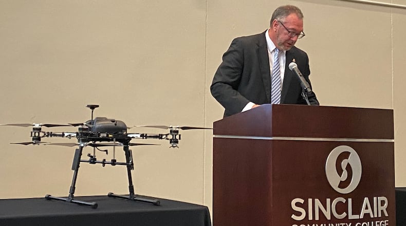 Steve Johnson, president of Sinclair Community College, speaks at a press conference announcing Sinclair's selection to join the world's leading unmanned aerial systems research team. Eileen McClory / Staff