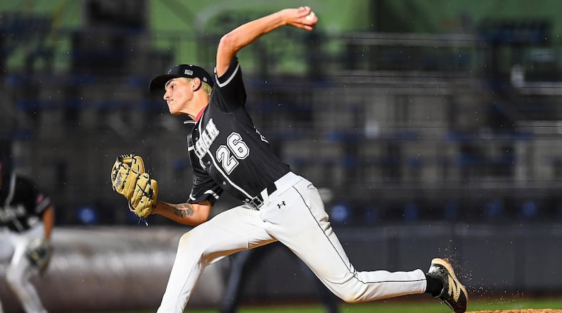 Graham's Hayden Van Hoose prepares to throw a pitch to the plate against Lynchburg-Clay during his Division V state semifinal game on Friday at Canal Park in Akron. KYLE HENDRIX / CONTRIBUTED