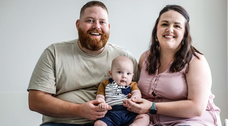 Quentin and Amanda Lauf and their 5-month-old baby, Case, at Shriners Children's of Ohio on Friday July 21, 2023. Case was born with a cleft lip and had a successful surgery at Shriners. JIM NOELKER/STAFF