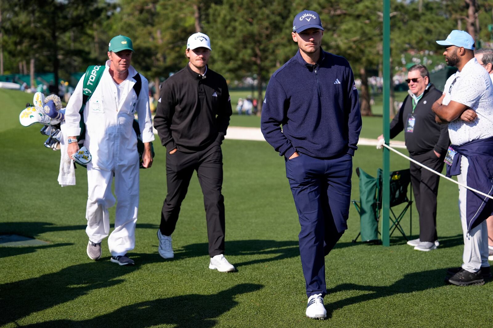 Rasmus Hojgaard, left, and Nicolai Hojgaard walk to the tee on the eighth hole during a practice around at the Masters golf tournament, Wednesday, April 9, 2025, in Augusta, Ga. (AP Photo/Ashley Landis)