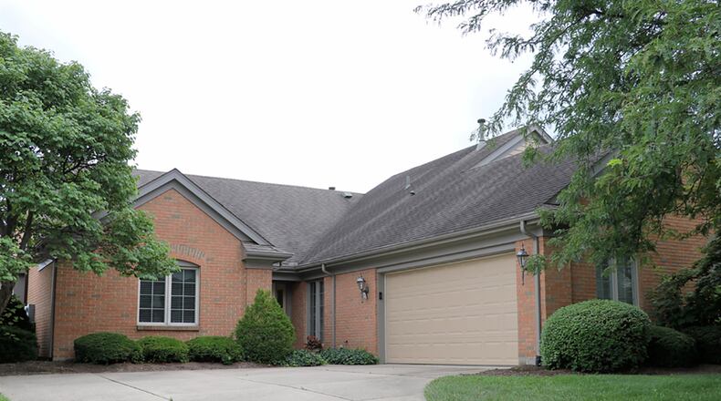 The 3-bedroom, brick ranch has about 2,140 sq. ft. of living space. The unit is one of two that has a backyard view of an open common area with brick gazebo. A concrete driveway leads up to an oversized, 2-car garage. CONTRIBUTED PHOTO BY KATHY TYLER