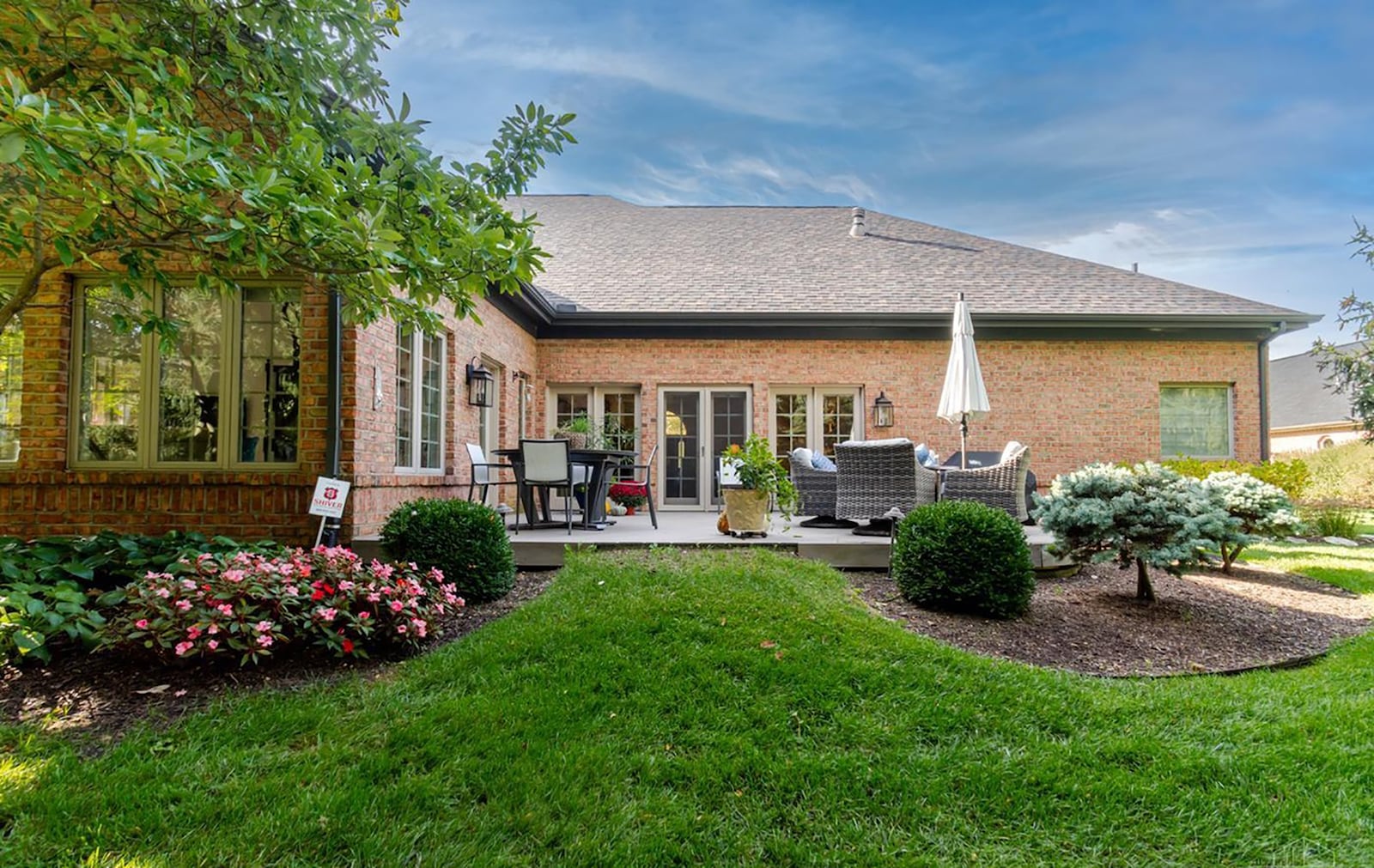 The home sits on .44 acres and is lined with mature trees in the back. There is a deck and stamped concrete walkway with professionally landscaped beds. CONTRIBUTED