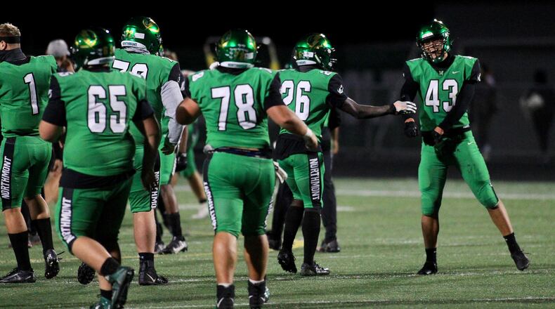Northmont's Xavier Vuong, right, celebrates after kicking the game-winning field goal in overtime against Springfield on Friday, Sept. 18, 2020, in Clayton. David Jablonski/Staff