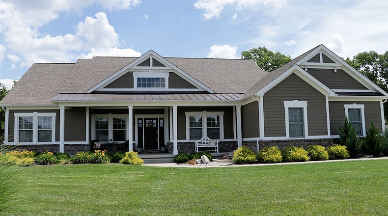 The custom-built ranch has about 4,530 sq. ft. of living space. The open split floor plan features bedroom suites on both the main and finished lower levels. The half-acre property has a concrete driveway that leads to a 3-car, side-entry garage. CONTRIBUTED PHOTO BY KATHY TYLER