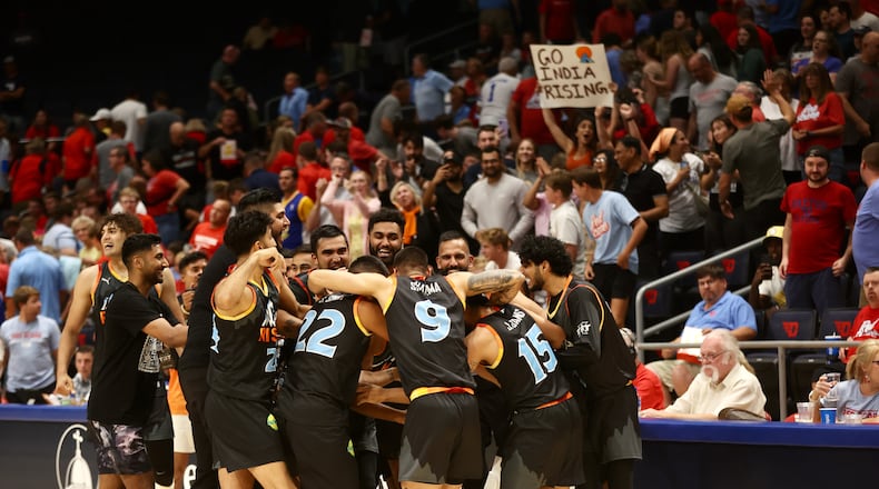 India Rising celebrates a victory against the Red Scare in the first round of The Basketball Tournament on Wednesday, July 26, 2023, at UD Arena in Dayton. David Jablonski/Staff