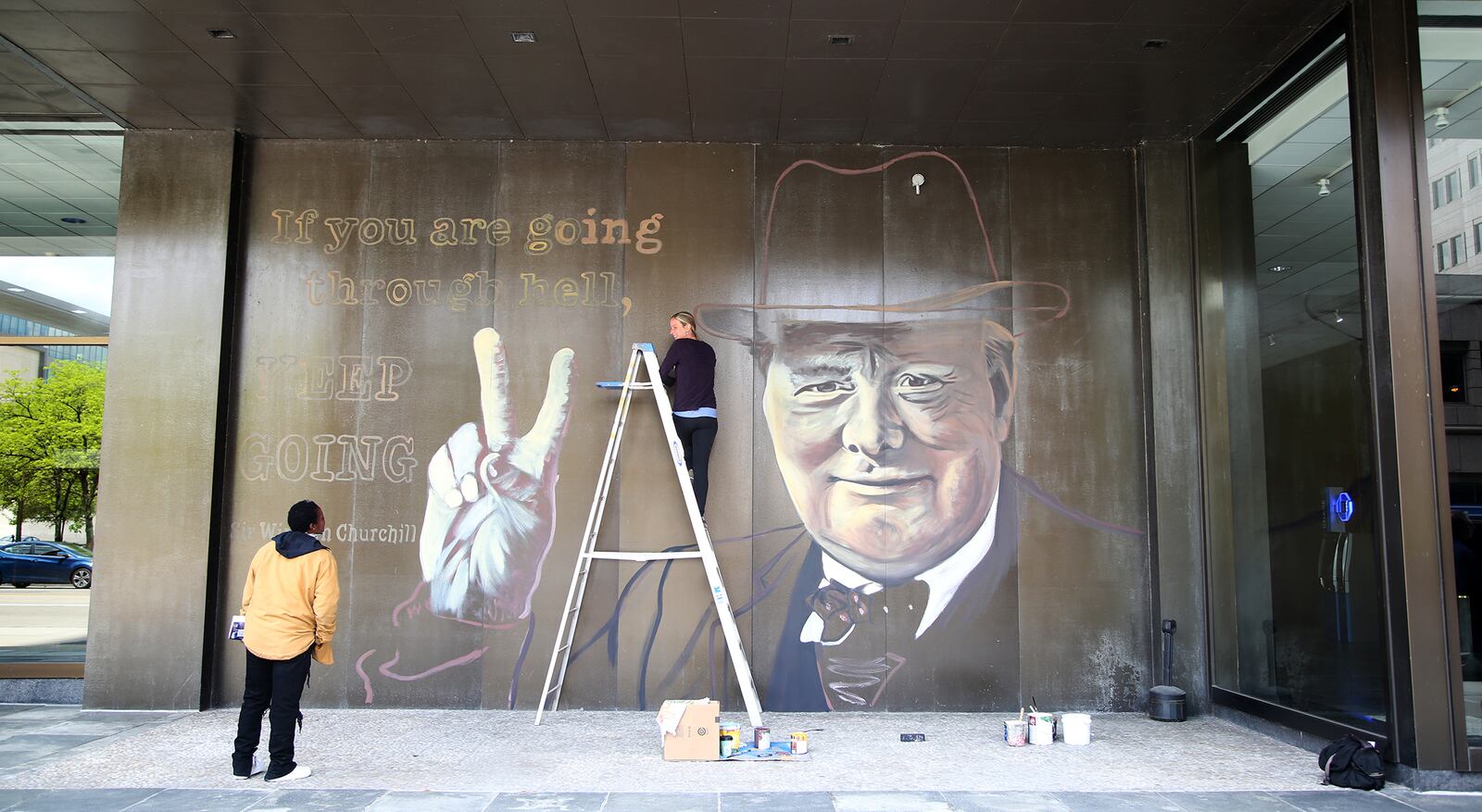Winston Churchill, prime minister of Great Britain during much of World War II, is the subject of the latest downtown Dayton mural on the Stratacache Tower. The image of Churchill, painted by mural artist Erica Arndts, is accompanied by a quote he is associated with, âIf you are going through hell, keep going.â LISA POWELL / STAFF