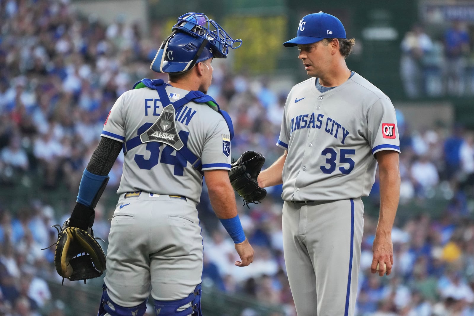Kansas City Royals catcher Freddy Fermin, left, talks with starting pitcher Rich Hill during the first inning of a baseball game against the Chicago Cubs in Chicago, Tuesday, July 22, 2025. (AP Photo/Nam Y. Huh)