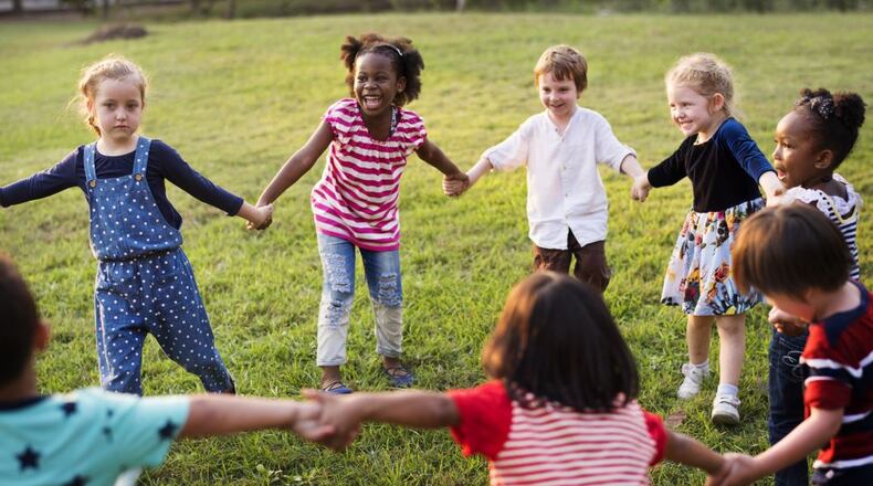When you’re a kid, there’s not much difference between being friendly and being friends. SHUTTERSTOCK