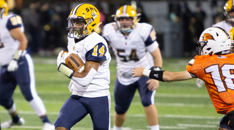 Springfield’s Tryon Barnes breaks through the Beavercreek defense on his way to a 58-yard touchdown run in the second quarter Friday of Springfield’s 76-0 victory at Beavercreek. Jeff Gilbert/CONTRIBUTED