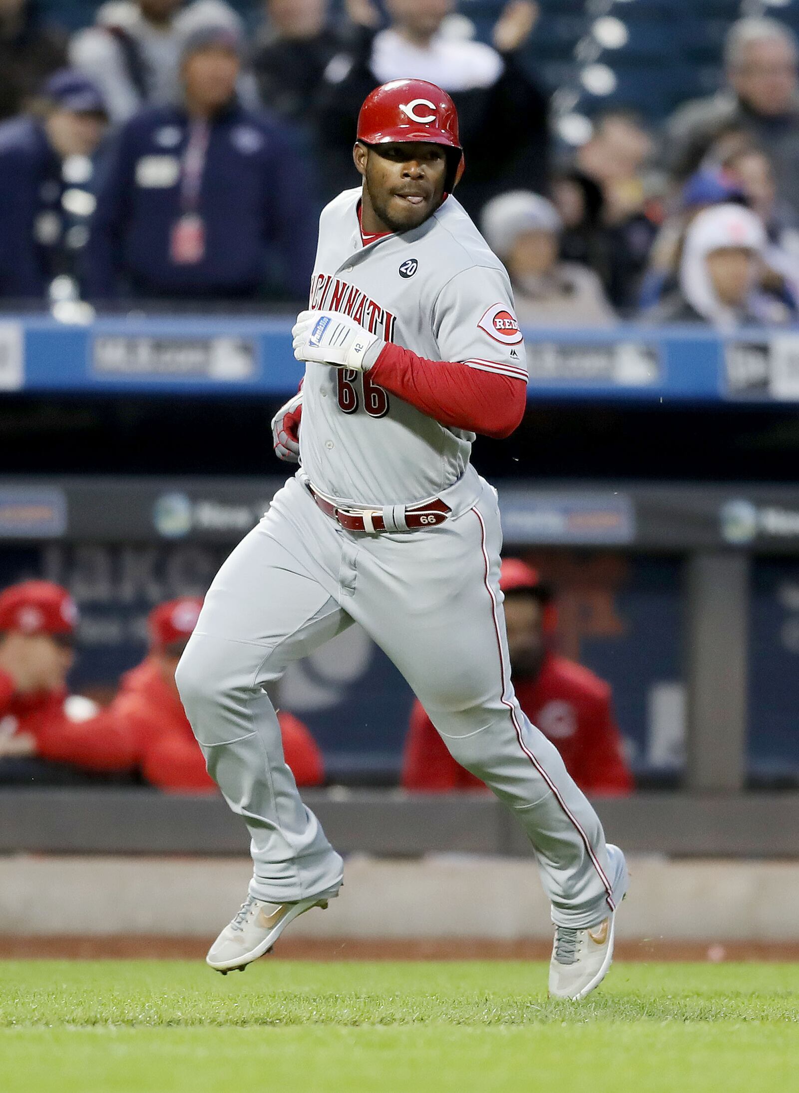 NEW YORK, NEW YORK - APRIL 29:  Yasiel Puig #66 of the Cincinnati Reds scores on an RBI double from teammate Jose Iglesias in the second inning against the New York Mets at Citi Field on April 29, 2019 in the Flushing neighborhood of the Queens borough of New York City. (Photo by Elsa/Getty Images)