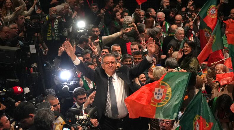 Center-left Socialist candidate António José Seguro celebrates after defeating far-right populist André Ventura in the second round of Portugal's presidential election in Lisbon, Sunday, Feb. 8, 2026. (AP Photo/Ana Brigida)