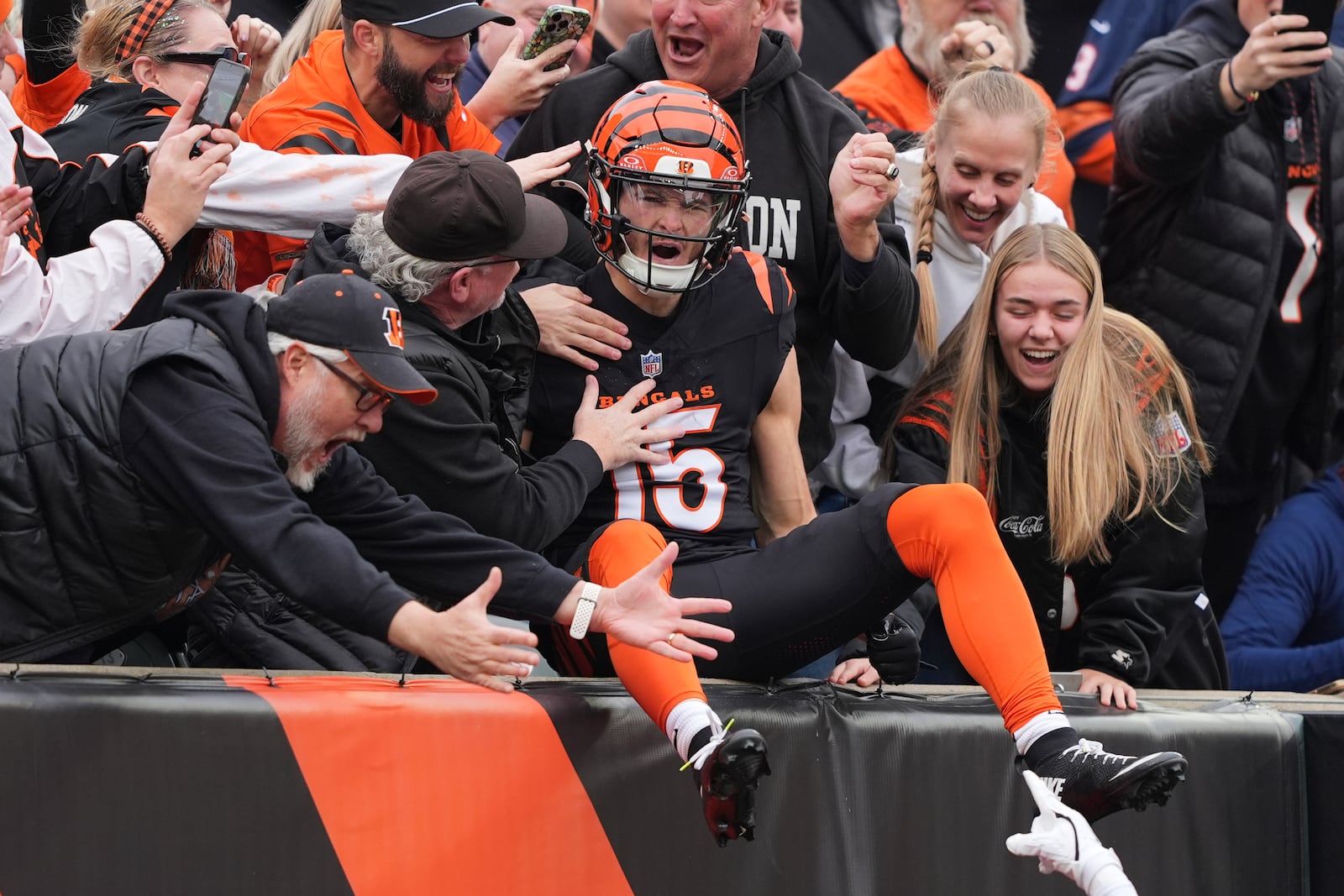 Cincinnati Bengals wide receiver Charlie Jones (15) celebrates after his opening kickoff return touchdown during the first half of an NFL football game against the Chicago Bears, Sunday, Nov. 2, 2025, in Cincinnati. (AP Photo/Joshua A. Bickel)