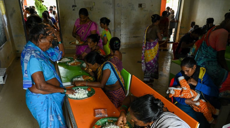 Evacuated Indian villagers of Uppada eat food in a temporary relief centre as Cyclone Montha, in Kakinada district of Andhra Pradesh, India, Tuesday, Oct. 28, 2025. (AP Photo)