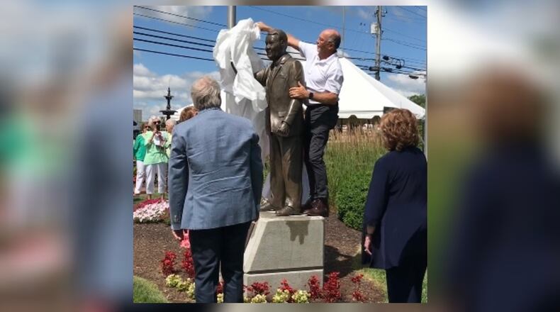Sculptor Mike Major of Urbana unveils the statute of former Troy Mayor Pete Jenkins
