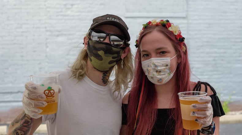 Prost! The 37th Annual Germanfest Picnic Lite was held at the Dayton Liederkranz-Turner German Club in Dayton's St. Anne's Hill Historic District from Friday, August 14th through Sunday, August 16, 2020. Even though the full festival couldn't be held at RiverScape MetroPark due to the COVID-19 pandemic, German food and beer were enjoyed by guests in two tents with socially distanced tables. The festival's signature food, beer and merchandise were available via a new online ordering option with the choice of carryout or curbside pickup which received an overwhelming response from the community. Did we spot you at the Kranz? TOM GILLIAM/CONTRIBUTING PHOTOGRAPHER