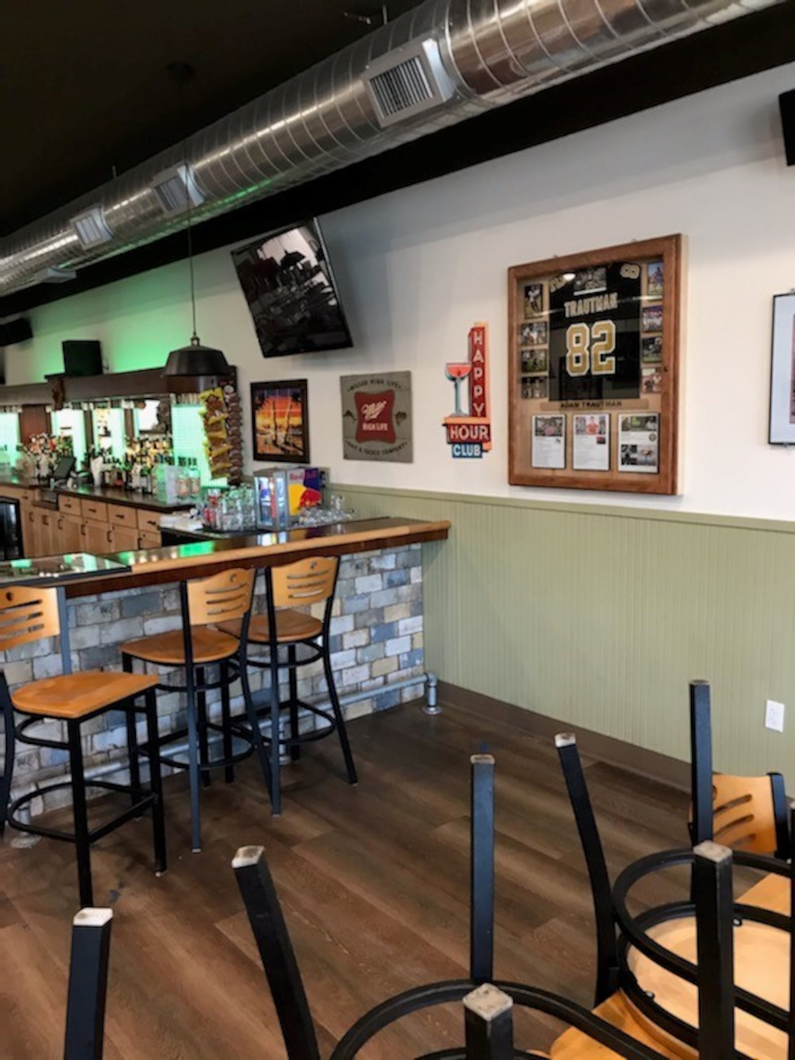 Adam Trautman's father Rod built a case for his son's Saints jersey which hangs in the local pub in their Michigan hometown. CONTRIBUTED