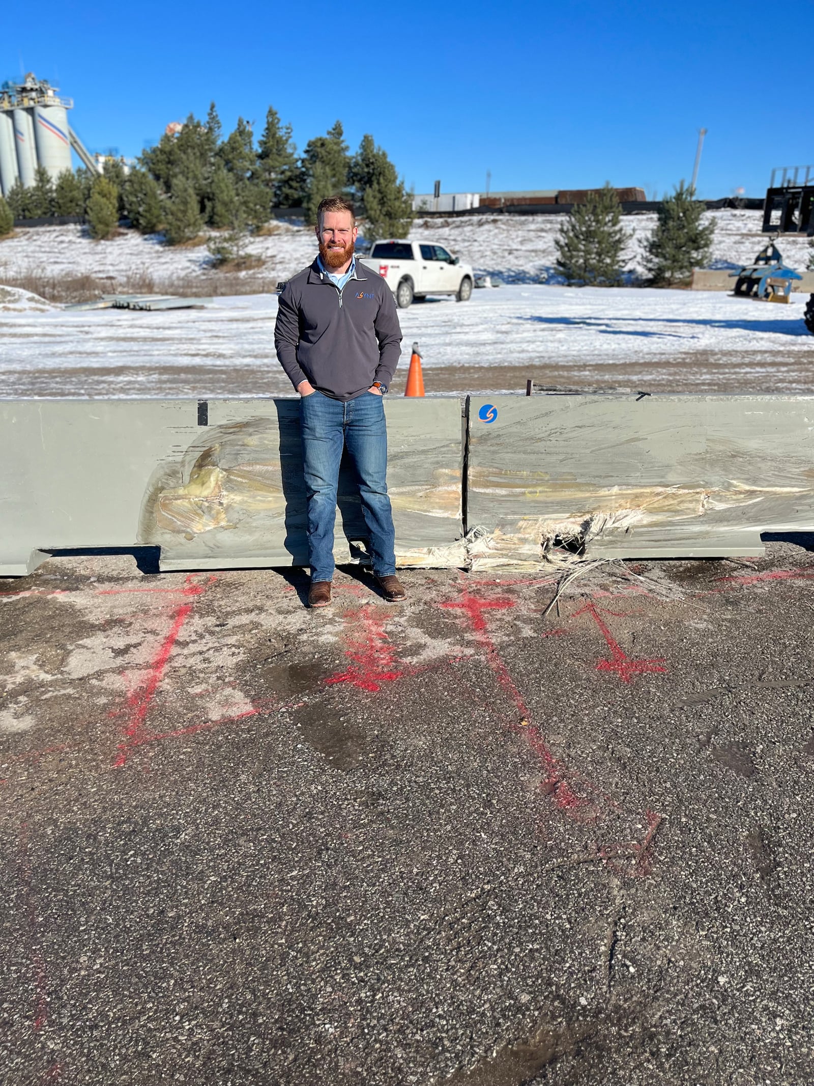 Archie Scott III with his Ape Barriers after the first successful crash test. He invented the fiberglass barrier as a replacement for the concrete barriers now in use across the country. He founded his company Asynt Solutions in 2024 and received his official patent for the barrier last year. CONTRIBUTED