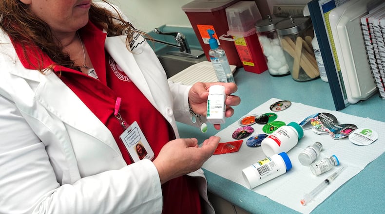 Kitty Smith, from the Clark County Combined Health District, talks about some of the medication used to treat STD’s in July 2020. Bill Lackey/Staff file