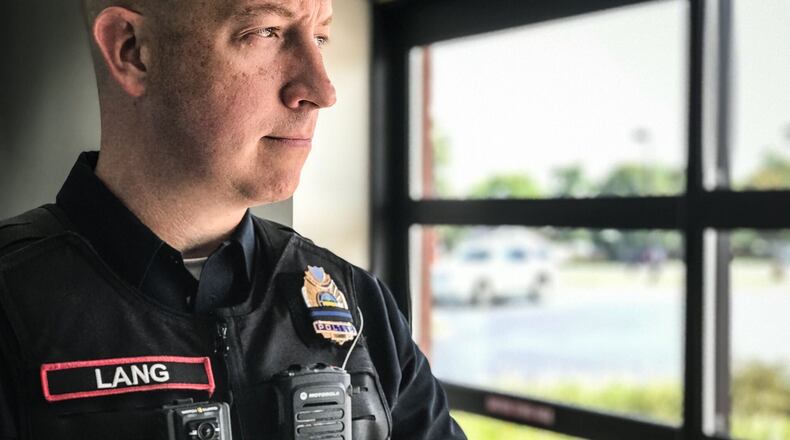 Englewood police Sgt. Mike Lang wears a WatchGuard body camera. Lang's department has had body cameras since 2014. The Montgomery County Sheriff's Office received initial approval by a county board Wednesday to purchase 200 units of the same model. JIM NOELKER / STAFF