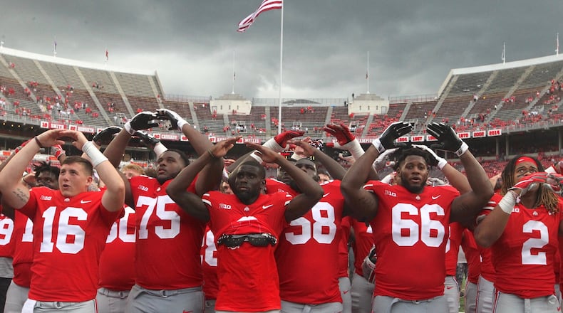 Ohio State players sing “Carmen Ohio” after a victory over Oregon State on Saturday, Sept. 1, 2018, at Ohio Stadium in Columbus. David Jablonski/Staff