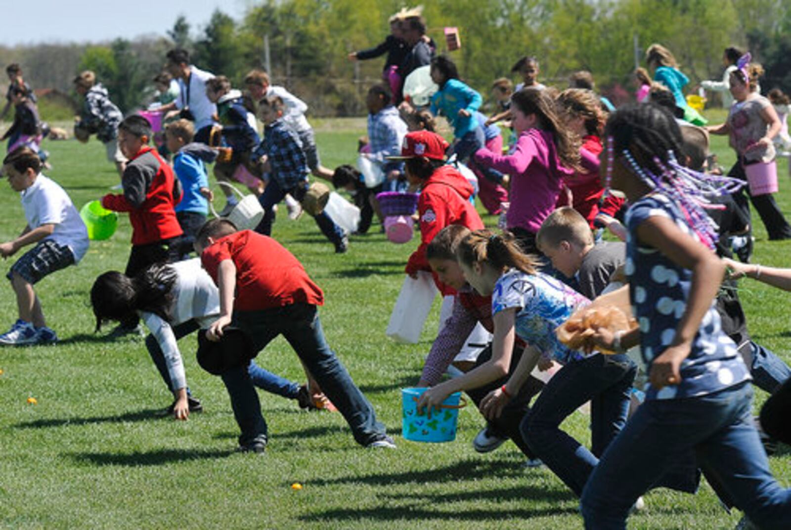 Young's Jersey Dairy held their 30th annual Easter Egg Hunt Sunday. Hundreds of children and their parents dashed across the Dairy's driving range trying to collect their share of the 5,400 hard boiled and dyed Easter Eggs during the annual tradition.