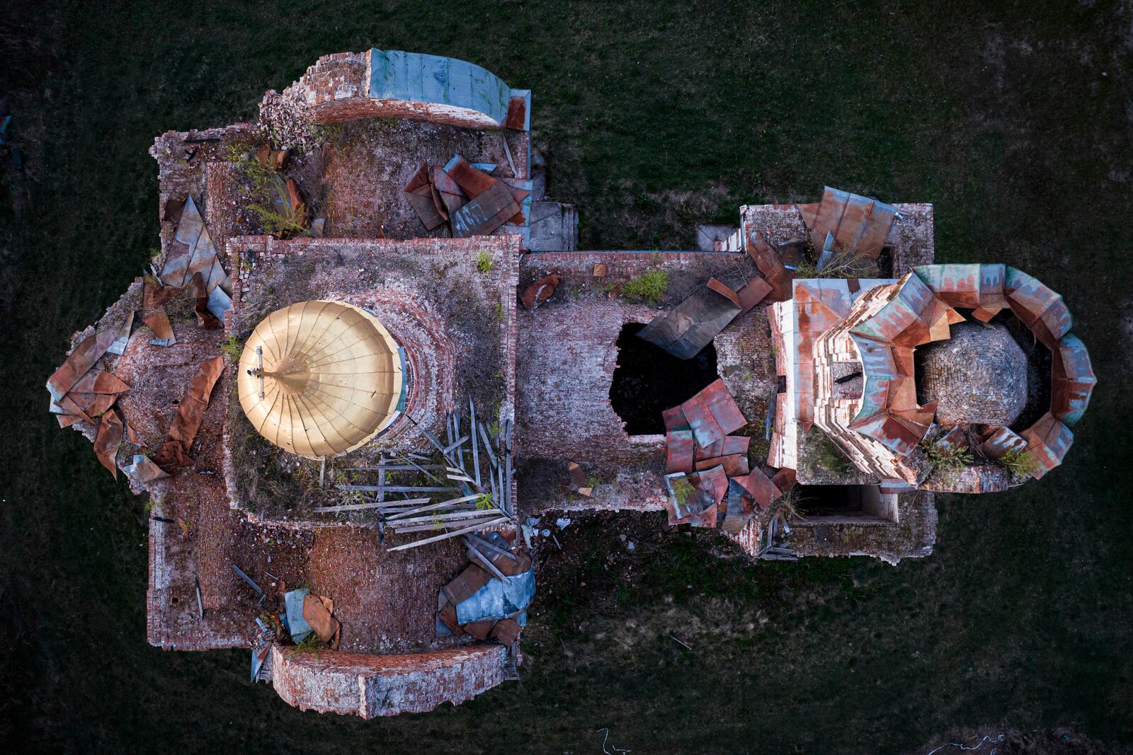 A church destroyed in fighting between Russian and Ukrainian forces is seen from above during celebration of the Orthodox Easter in Lukashivka village, Ukraine, on Sunday, April 20, 2025. (AP Photo/Evgeniy Maloletka)