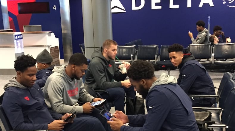 Dayton Flyers players wait for their flight to California on Sunday morning at Cincinnati/Northern Kentucky International Airport. Larry Hansgen / STAFF