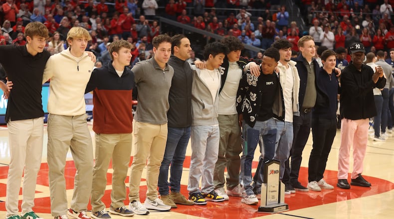 The Dayton men's soccer team is honored during a men's basketball game against George Washington on Tuesday, Jan. 30, 2024, at UD Arena. David Jablonski/Staff