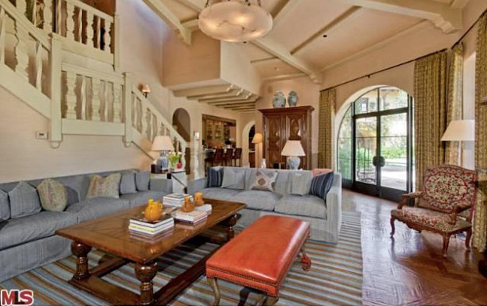 Mediterranean-style home features pool, spa