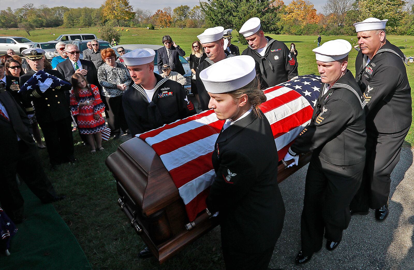 Members of a Navy honor guard carry the remains of William “Billy” Welch to the grave site at Calvary Cemetery. Welch was killed  in 1941 during the bombing of Pearl Harbor and his remains were identified in 2016. Welch, who attended Catholic Central High School, was buried with full military honors. Bill Lackey/Staff