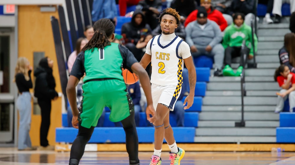 The Northmont High School boys basketball team overcame a 16-point first half deficit to beat Springfield 68-60 on Friday night at Springfield High School. MICHAEL COOPER / STAFF