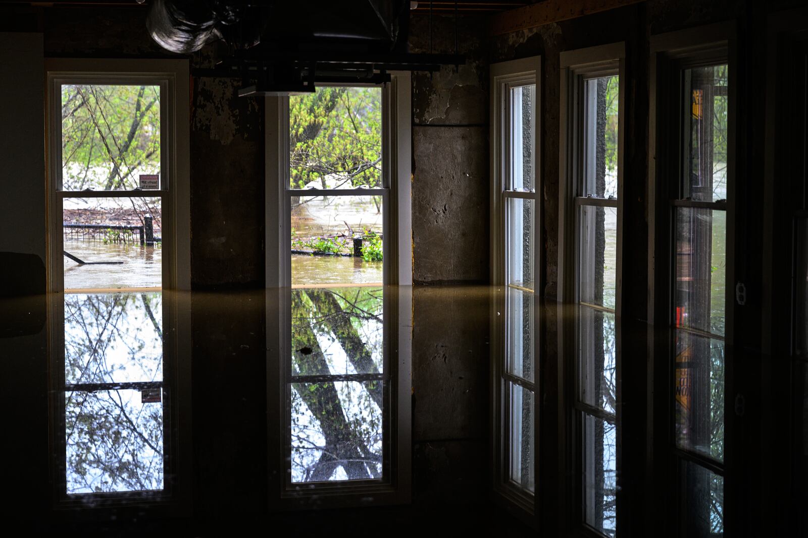 The flooded first floor of Wes Anderson's home is seen as the rising Kentucky River flows outside on Saturday, April 5, 2025, in Frankfort, Ky. (AP Photo/Jon Cherry)
