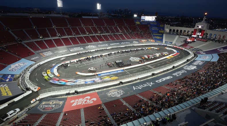 FILE - Cars race during the Busch Light Clash NASCAR exhibition auto race at Los Angeles Memorial Coliseum, Feb. 3, 2024, in Los Angeles. (AP Photo/Mark J. Terrill, File)