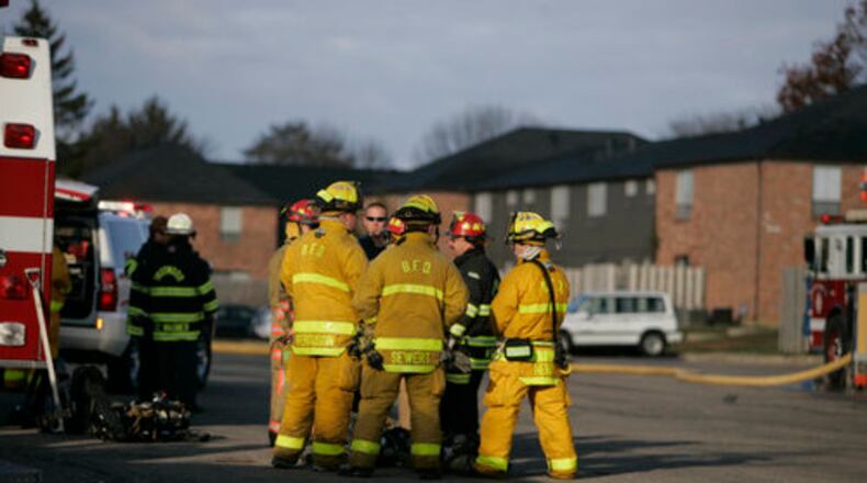 Englewood firefighters respond to an apartment fire at Deer Creek Apartment on Shioh Springs Road near Olive Road. The residence escaped without injury. Two families were affected by the blaze on Oct. 27, 2008.