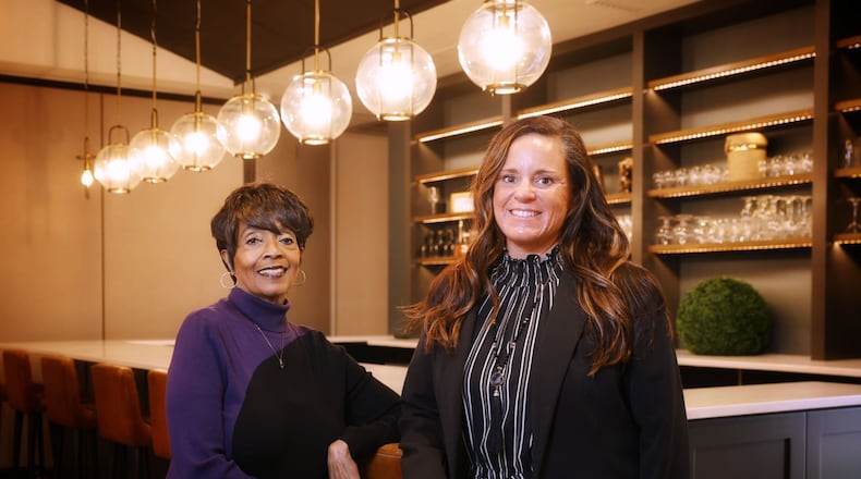 New director Angie Smith, right, and administrative assistant Antoinette Coleman stand in the dining and ballroom area of the Middletown Event Center on Central Avenue in Middletown. NICK GRAHAM/STAFF