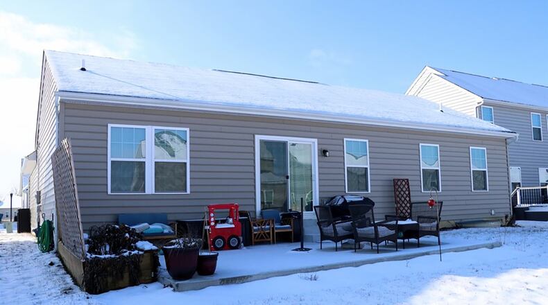 Patio doors open from the breakfast area to a semi-private, concrete patio and open back yard.