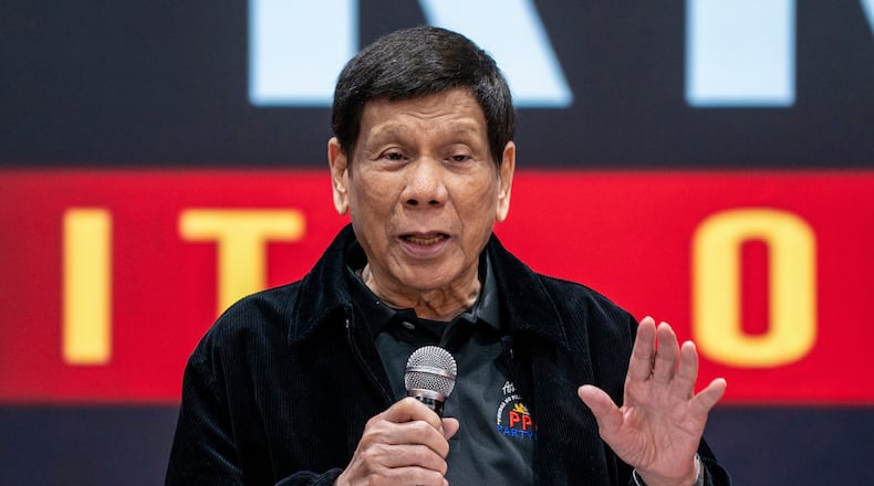 FILE - Former President of the Philippines Rodrigo Duterte speaks inside the Southorn Stadium during a thanksgiving gathering organized by Hong Kong-based Filipino workers for the former populist president in Hong Kong on March 9, 2025. (AP Photo/Vernon Yuen, File)